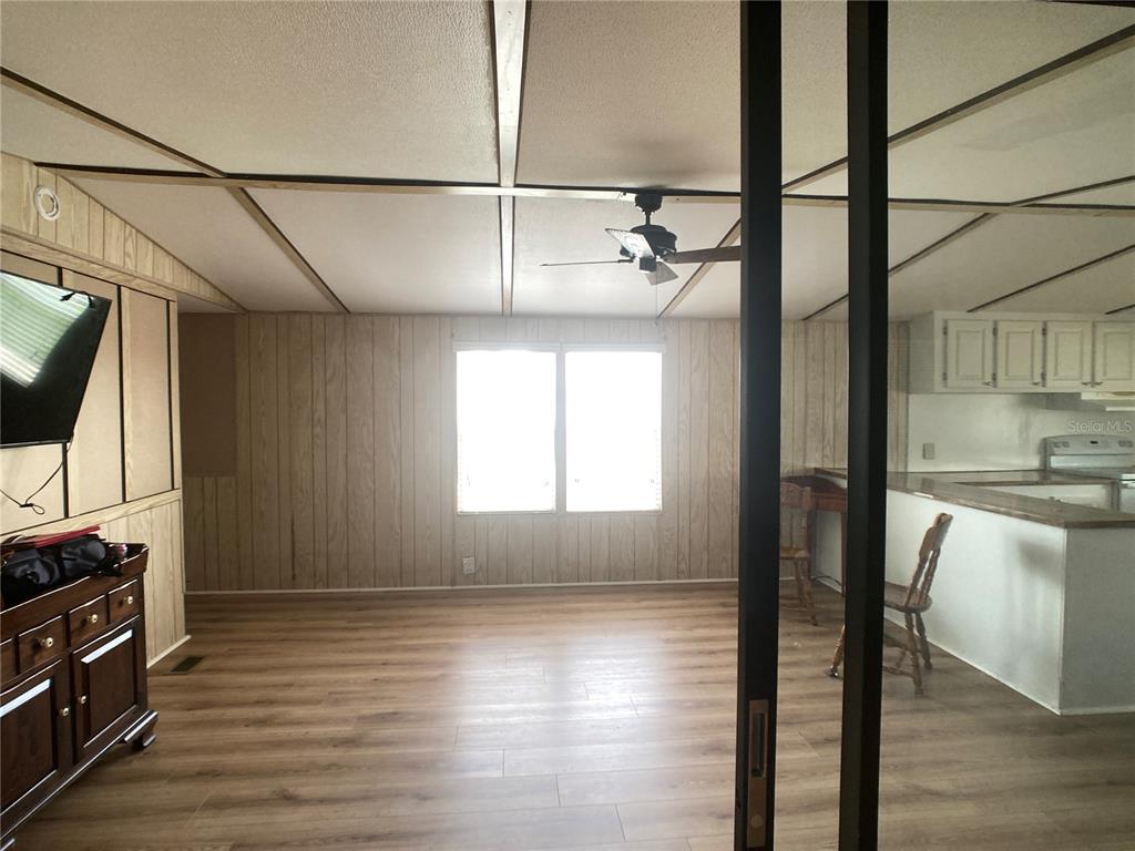 1710 7th Street Southwest, Unit 82 Ruskin, FL 33570 - Photo 7 of 19 a view of a kitchen with a sink wooden floor and a window