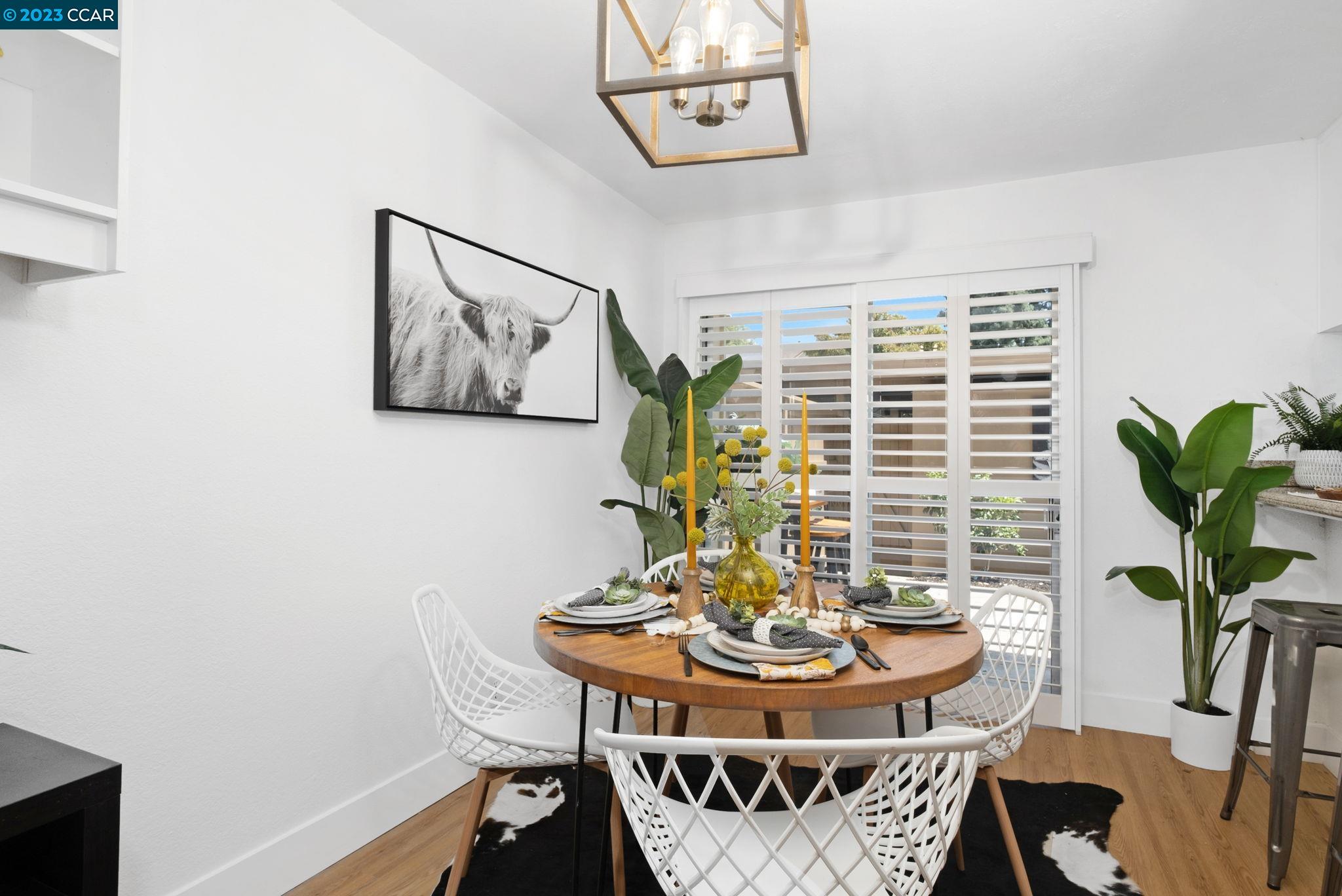 1875 Pomar Way Walnut Creek, CA 94598 - Photo 11 of 32 a view of a dining room with furniture and wooden floor
