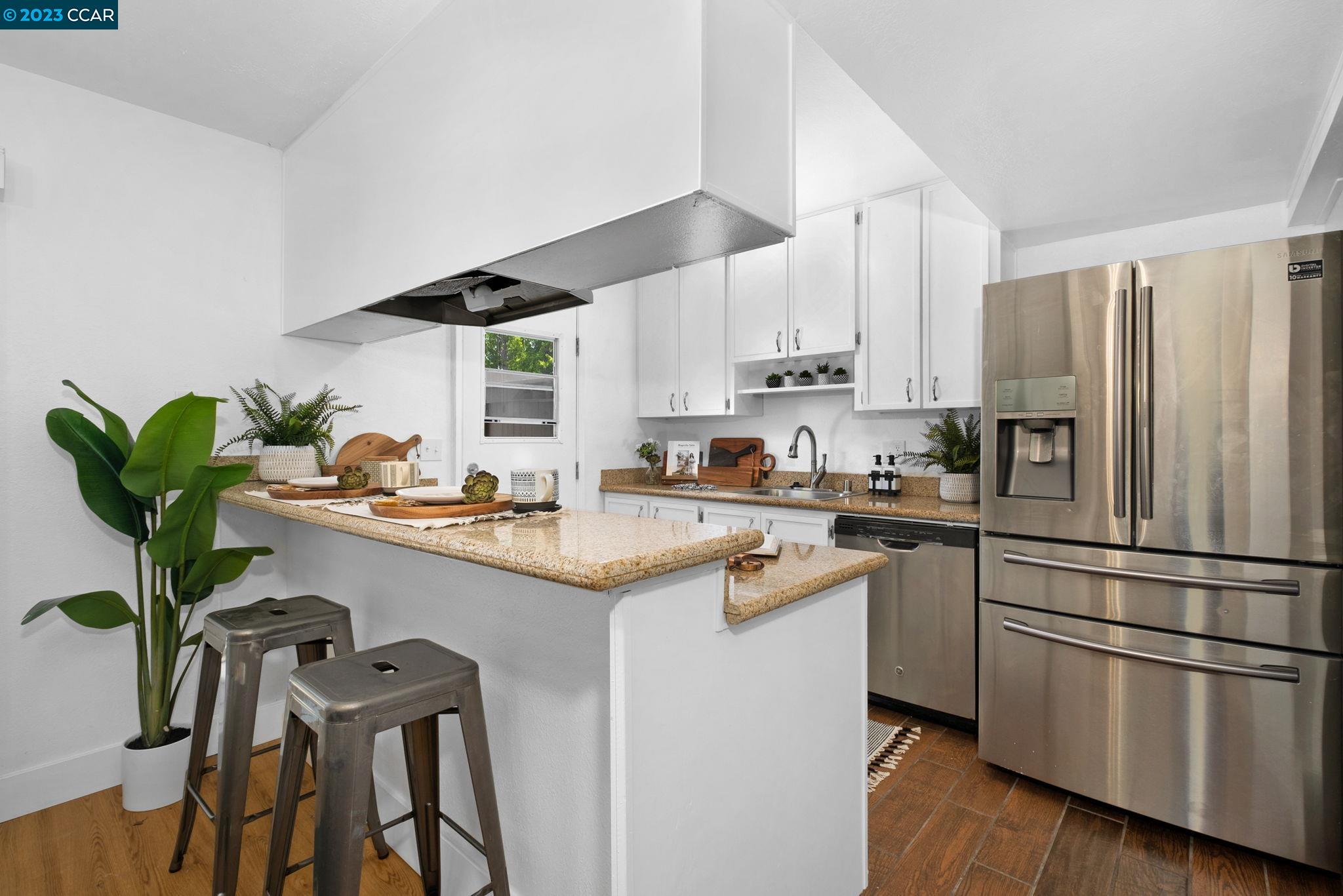 1875 Pomar Way Walnut Creek, CA 94598 - Photo 13 of 32 a kitchen with appliances cabinets and a potted plant