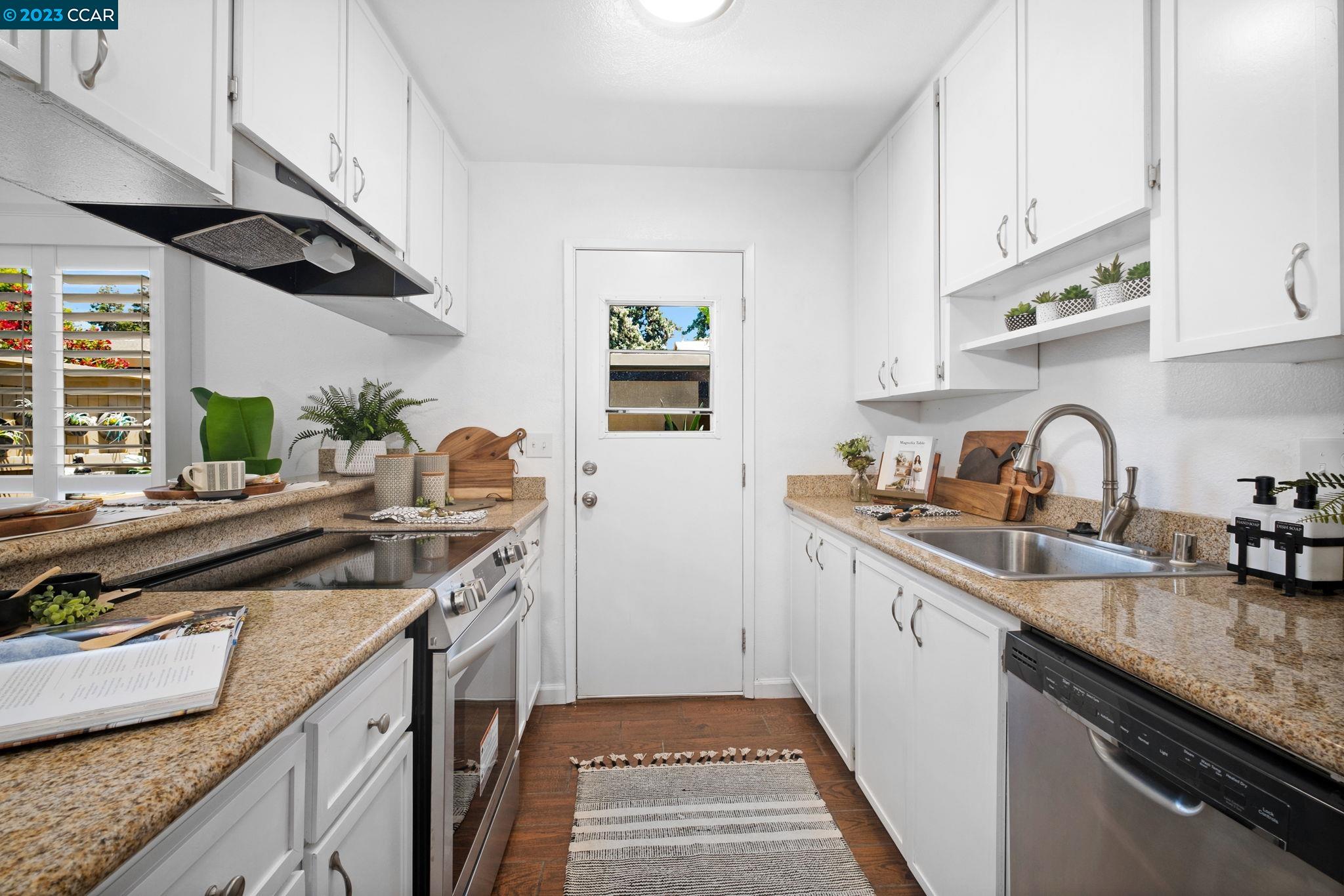 1875 Pomar Way Walnut Creek, CA 94598 - Photo 14 of 32 a kitchen with granite countertop a sink and a stove