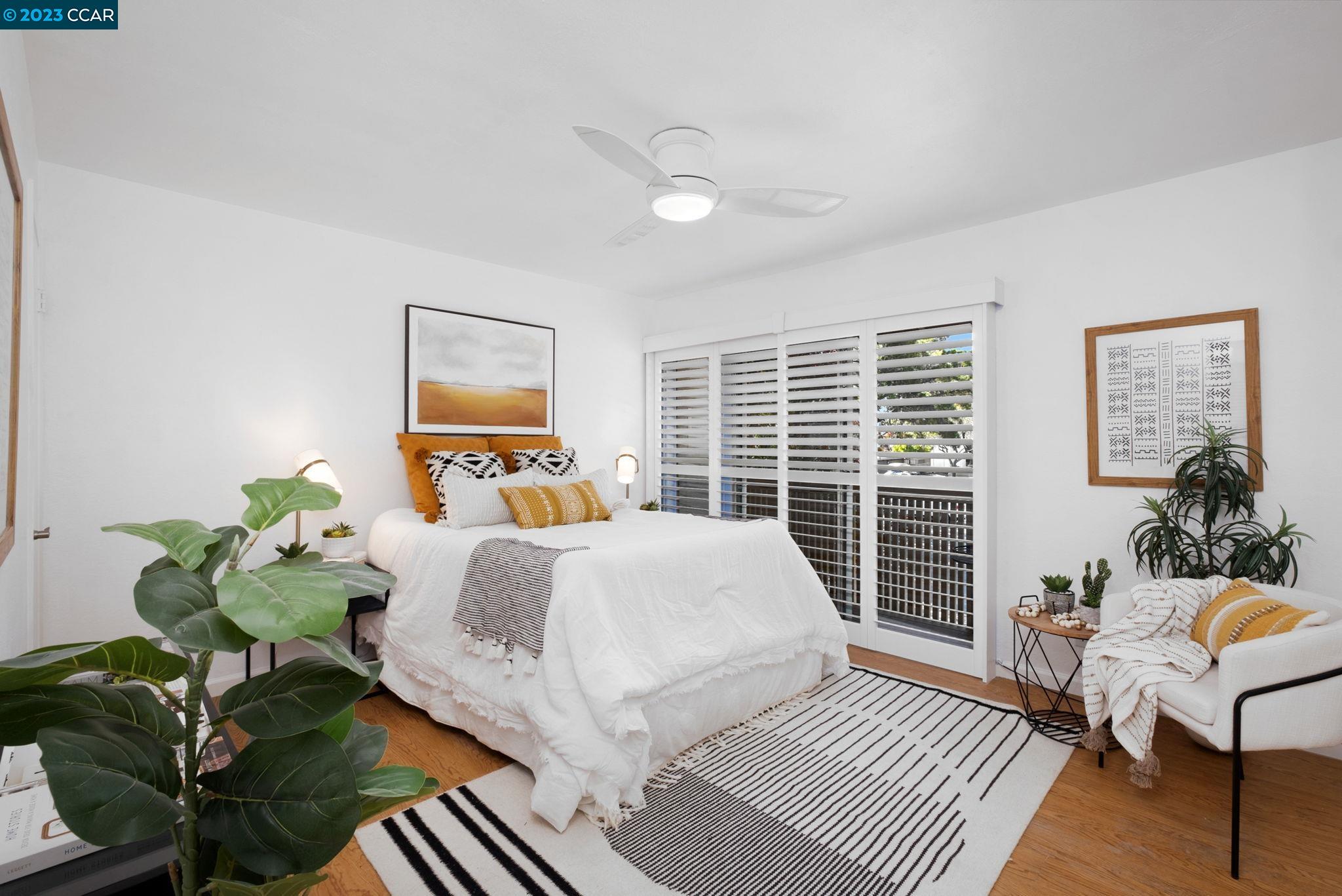 1875 Pomar Way Walnut Creek, CA 94598 - Photo 19 of 32 a bedroom with a bed and wooden floor