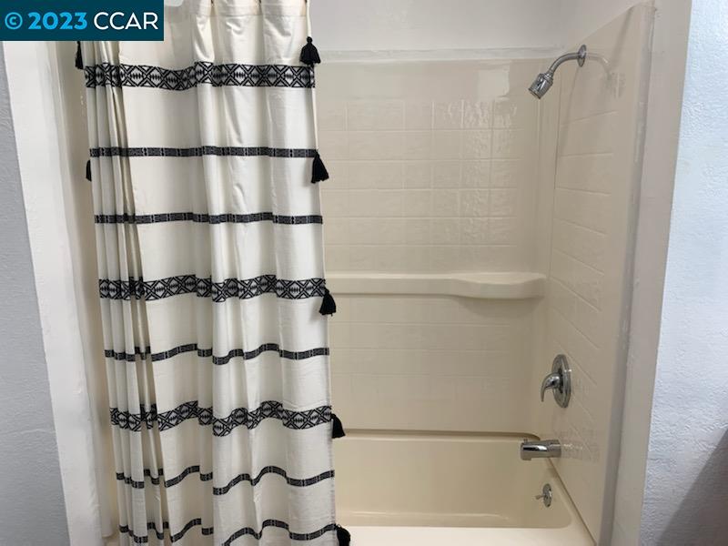 1875 Pomar Way Walnut Creek, CA 94598 - Photo 23 of 32 a bathroom with a shower and a tub