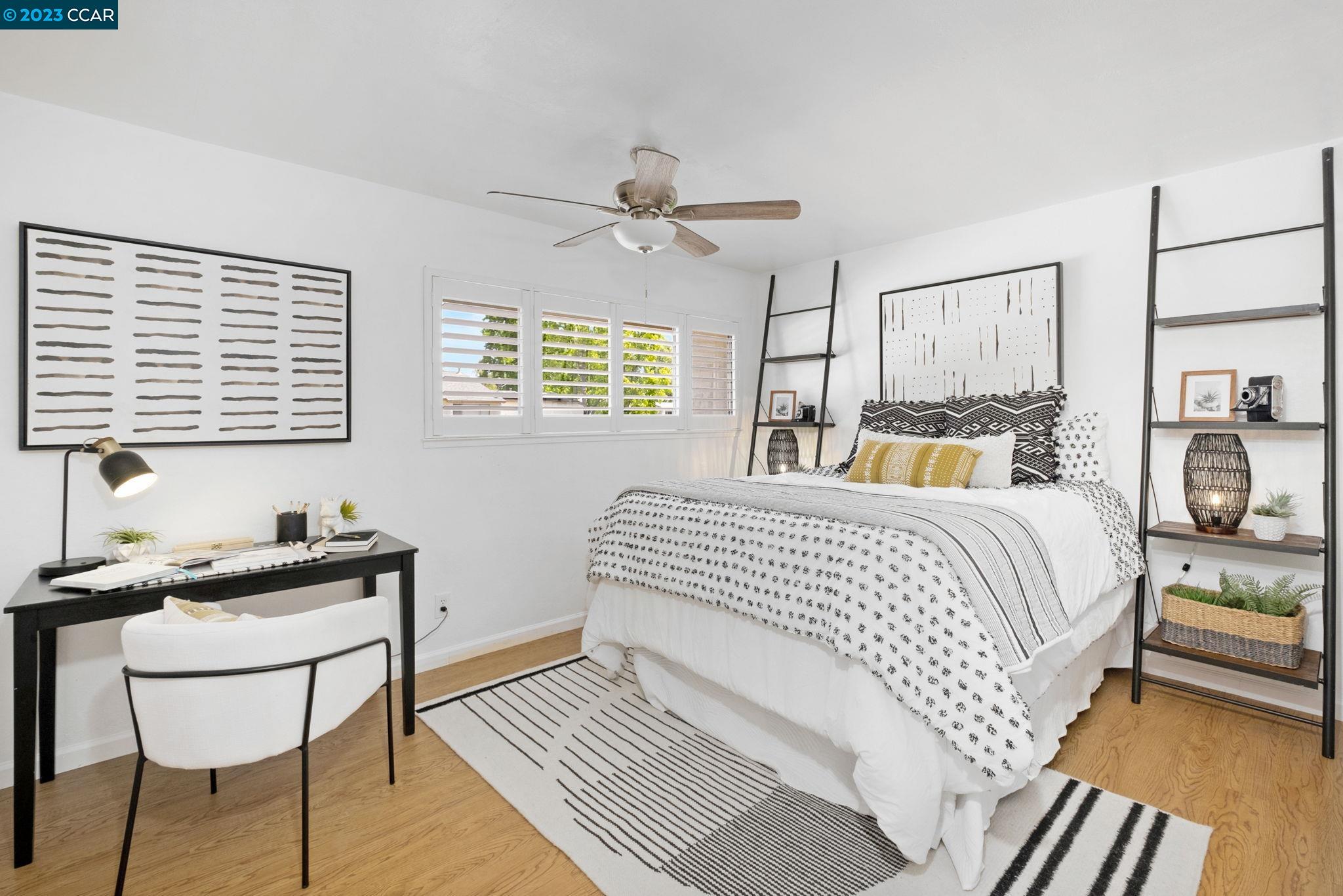 1875 Pomar Way Walnut Creek, CA 94598 - Photo 24 of 32 a bedroom with a bed and wooden floor