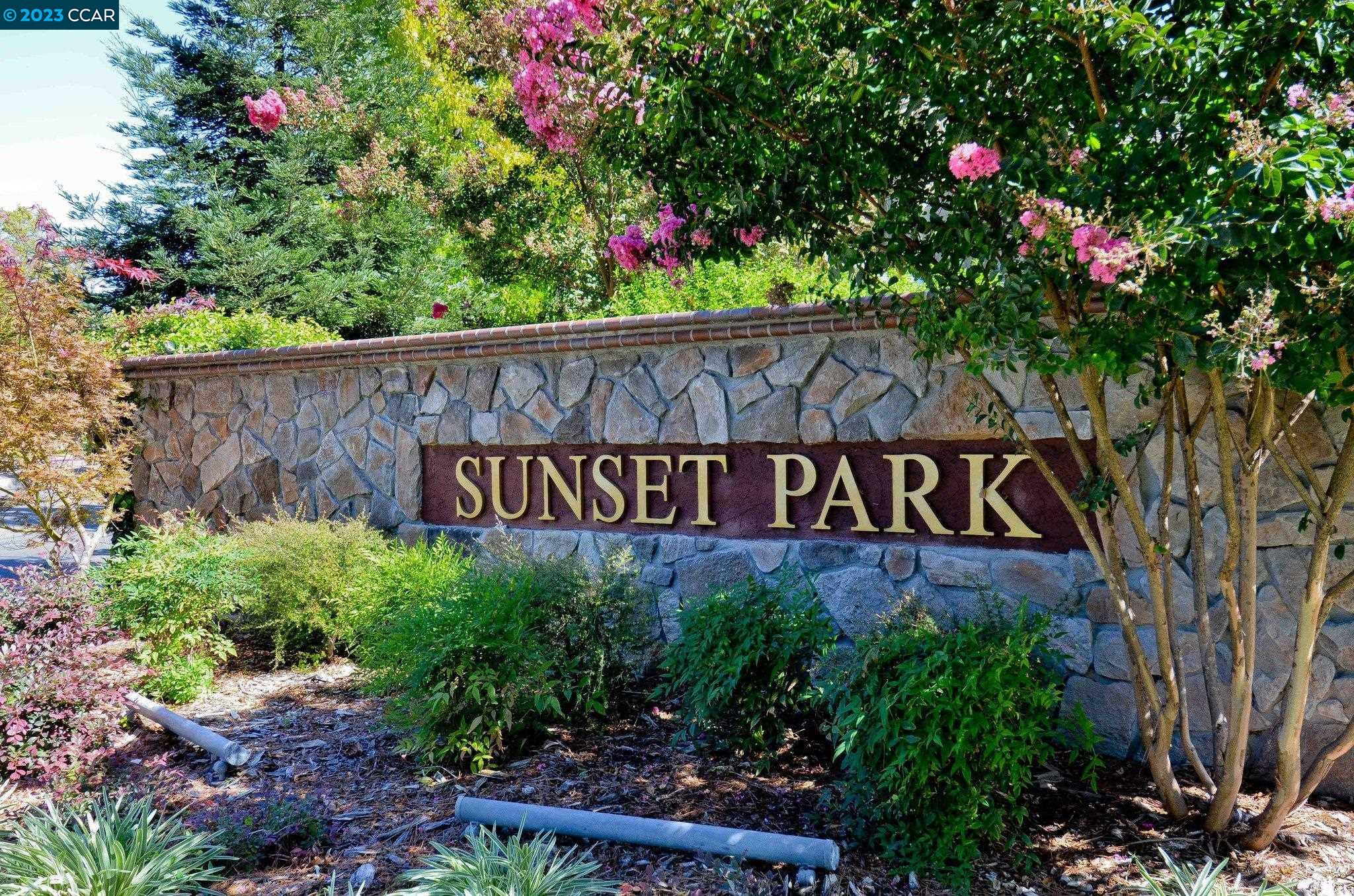 1875 Pomar Way Walnut Creek, CA 94598 - Photo 27 of 32 a sign that is in front of flowers
