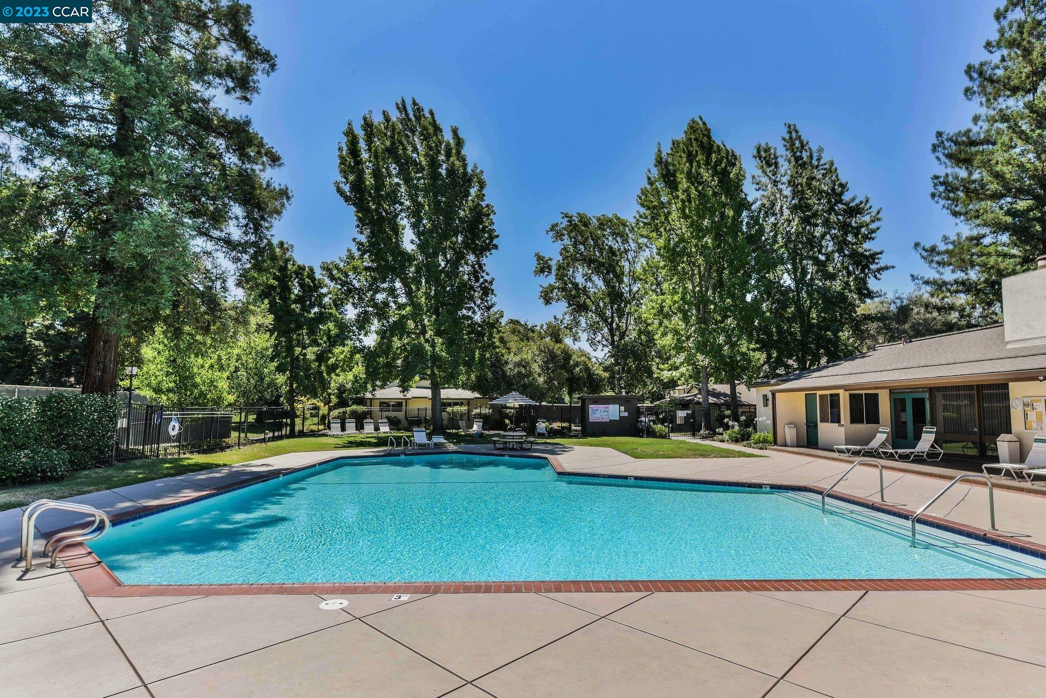 1875 Pomar Way Walnut Creek, CA 94598 - Photo 28 of 32 a view of a swimming pool with lawn chairs and plants