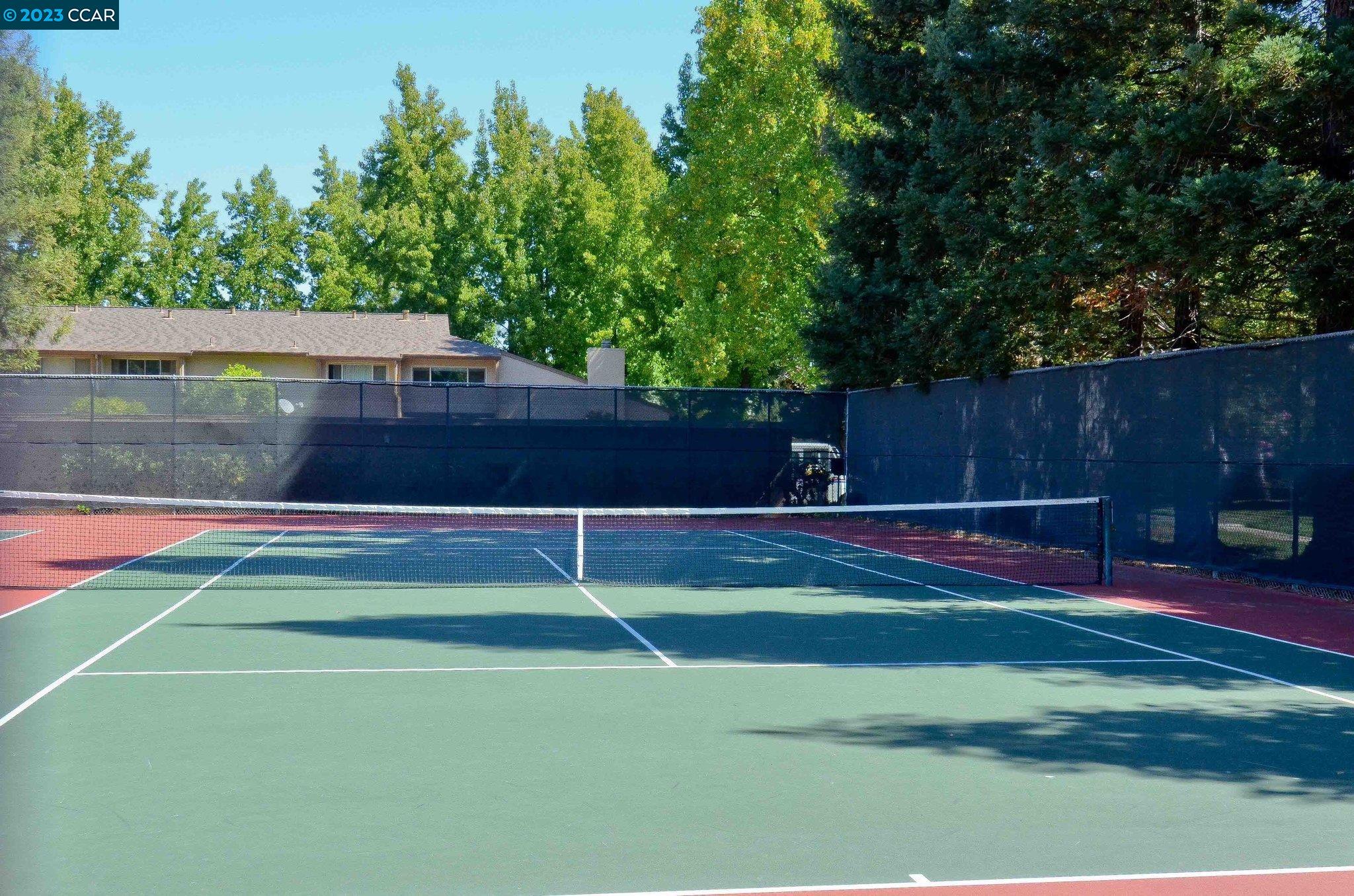 1875 Pomar Way Walnut Creek, CA 94598 - Photo 29 of 32 a view of a tennis ground with large trees