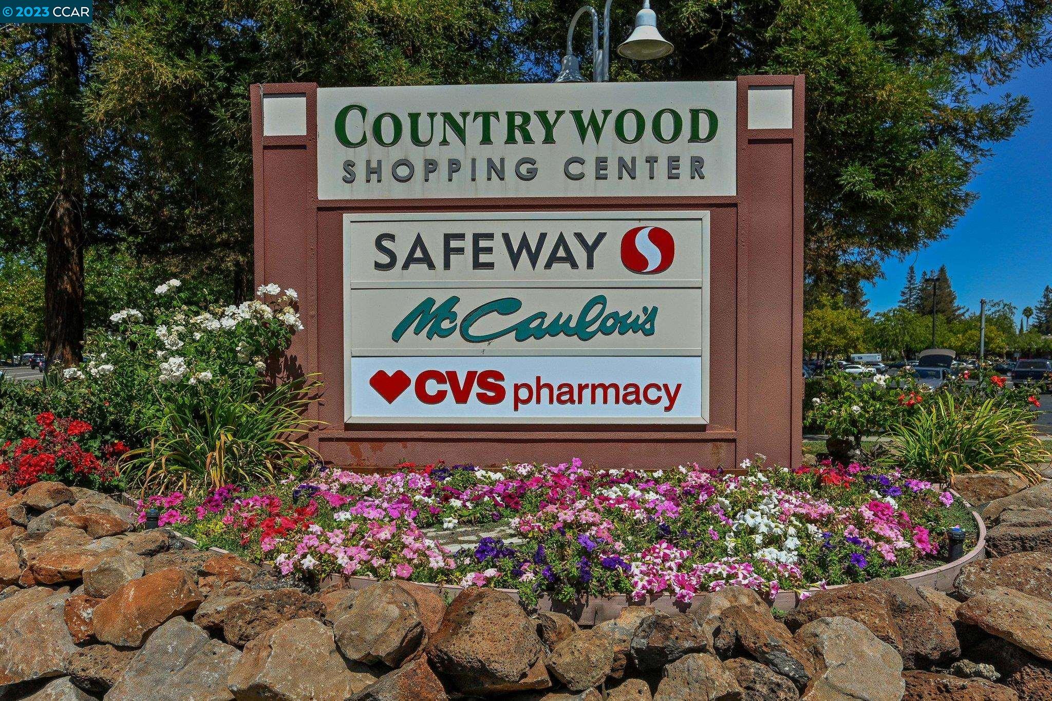 1875 Pomar Way Walnut Creek, CA 94598 - Photo 32 of 32 a sign that is in front of flowers