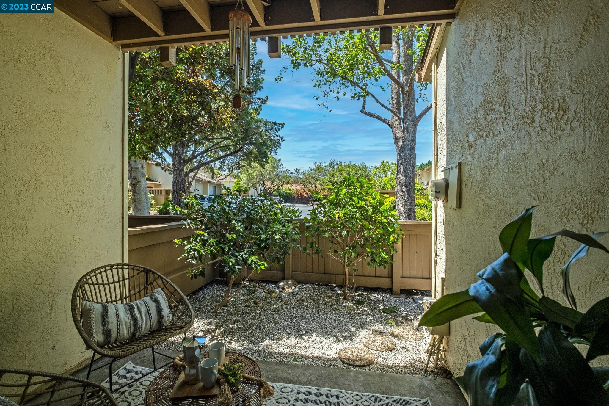1875 Pomar Way Walnut Creek, CA 94598 - Photo 8 of 32 a backyard of a house with large trees and plants