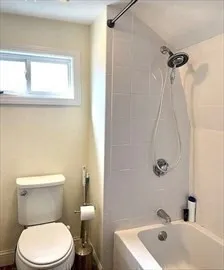 a bathroom with a sink a toilet and a bathtub
