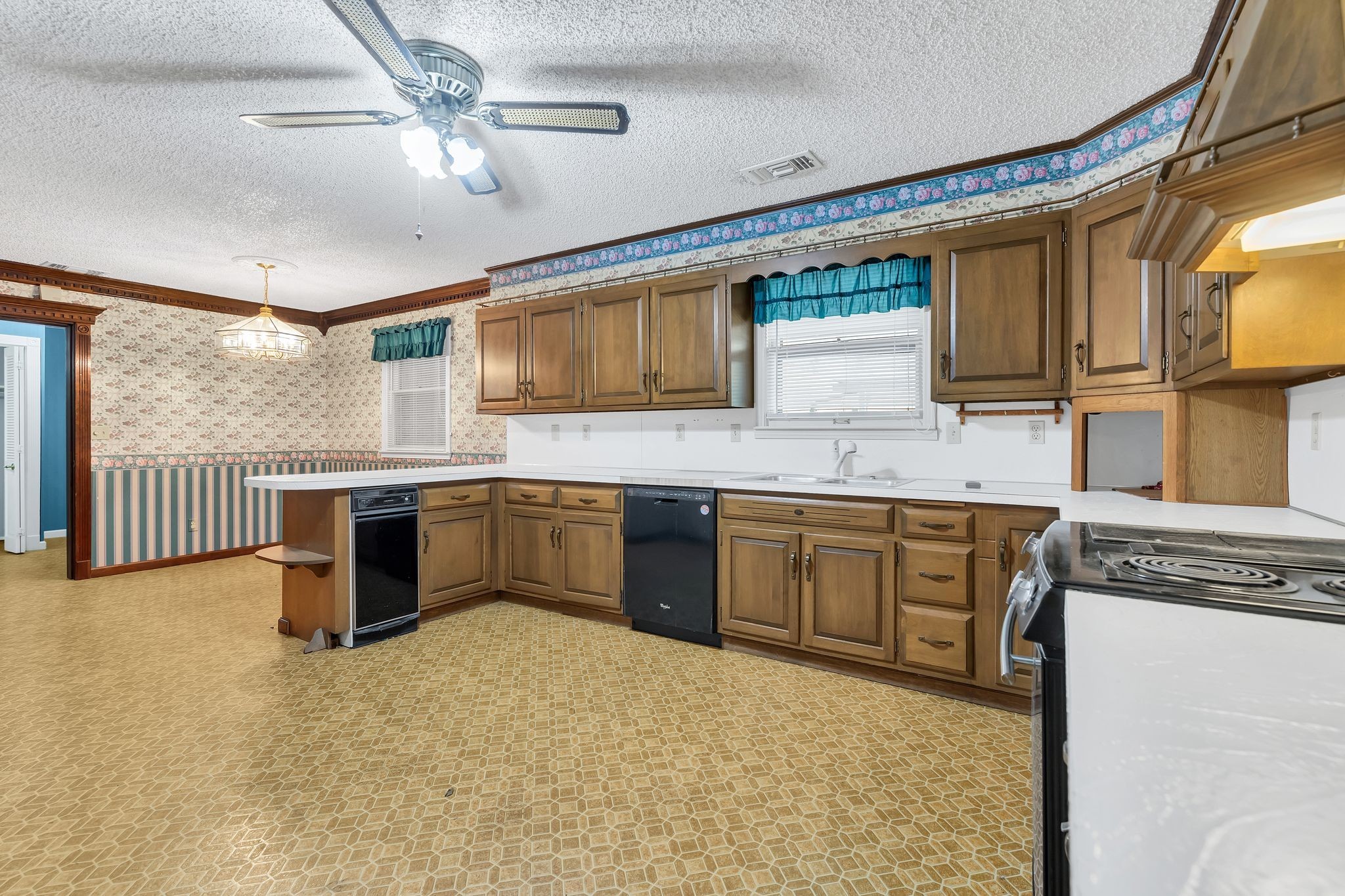 11075 Old Lebanon Road Murfreesboro, TN 37129 - Photo 18 of 44 a kitchen with stainless steel appliances granite countertop a sink a stove top oven a chimney cabinets and a counter top space