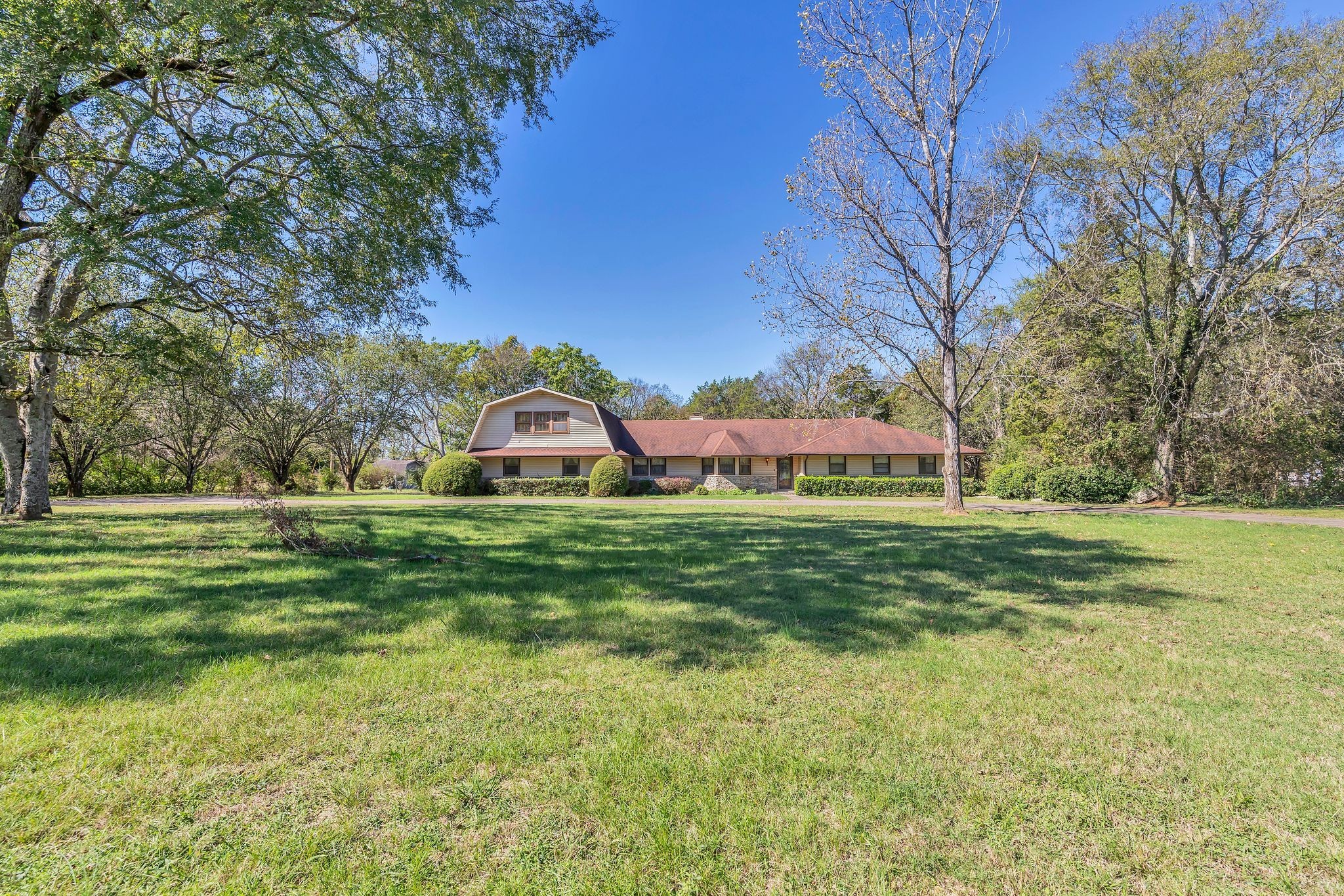 11075 Old Lebanon Road Murfreesboro, TN 37129 - Photo 4 of 44 a view of a big yard with a house in the background