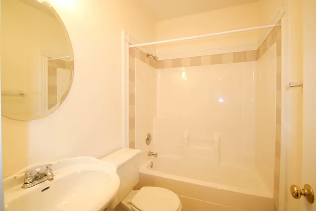 a bathroom with a toilet and a bathtub
