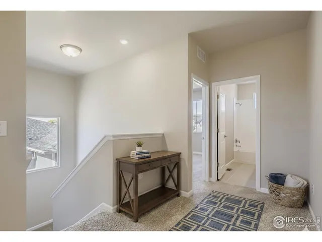 a bedroom with a bed and a desk