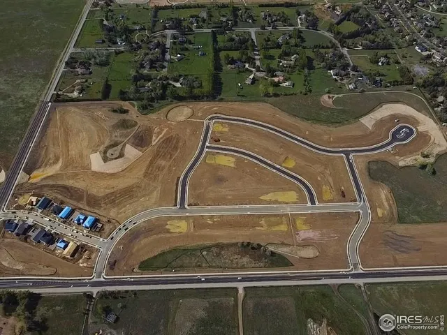a swimming pool with outdoor seating and yard