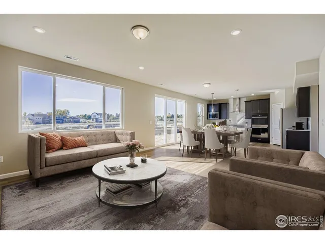 a living room with furniture and a table