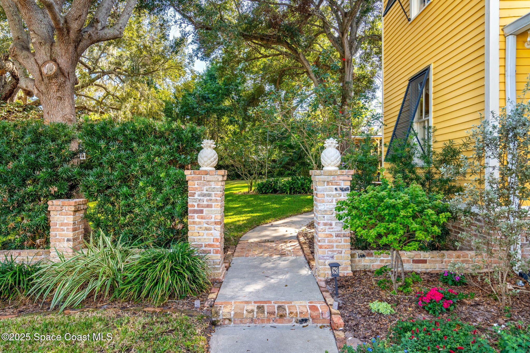 27 Barton Avenue Rockledge, FL 32955 - Photo 67 of 85 side yard entrance