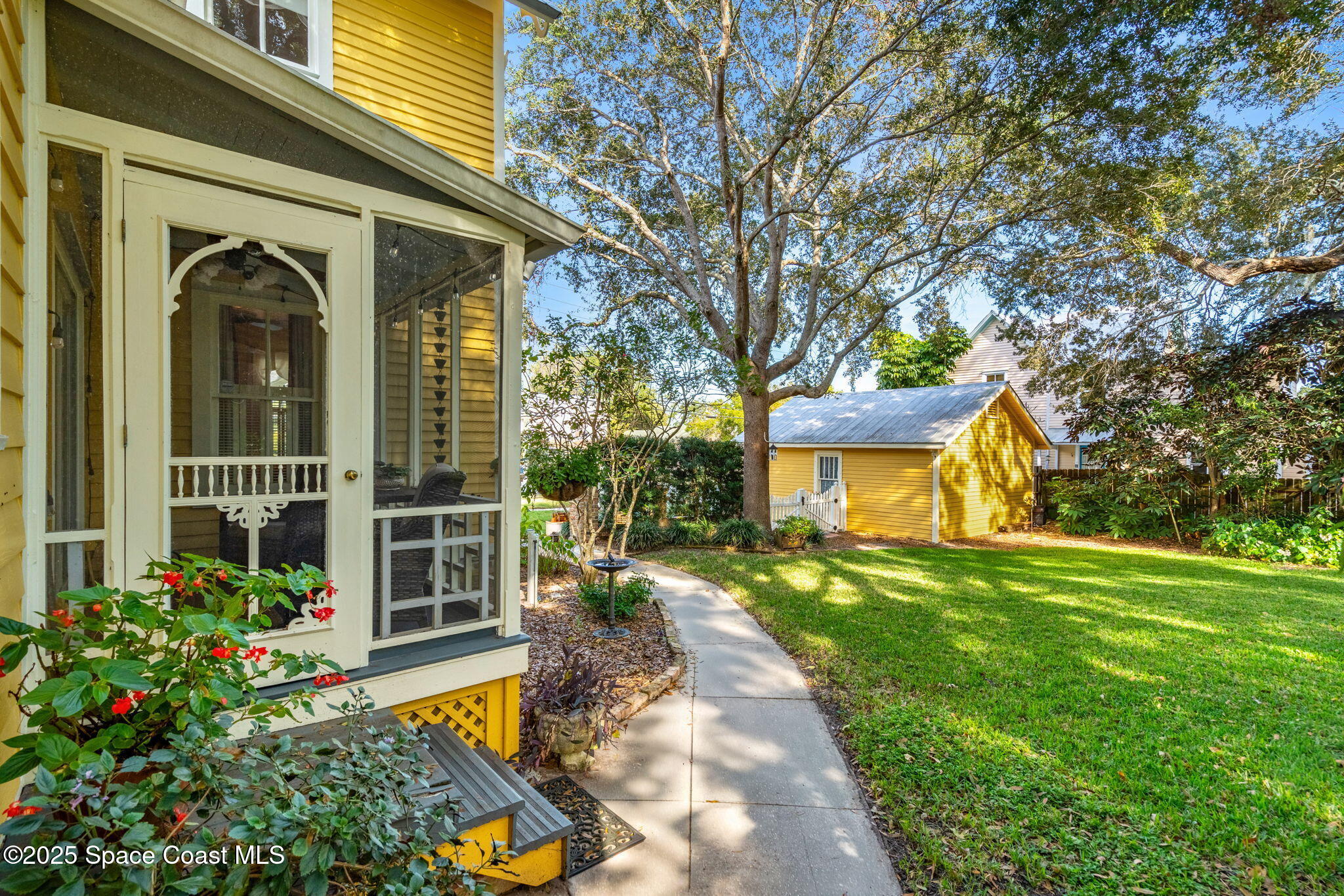 27 Barton Avenue Rockledge, FL 32955 - Photo 76 of 85 side yard & sun room entrance