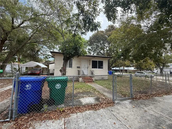 an empty room with a ceiling fan and carpet