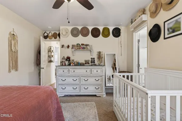 a bedroom with a bed and cabinets