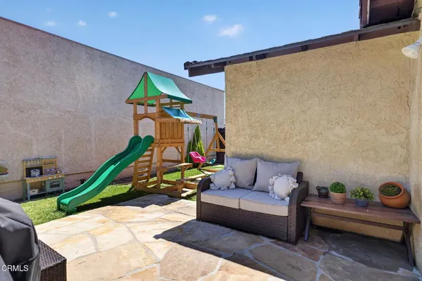 a living room with furniture and a yard