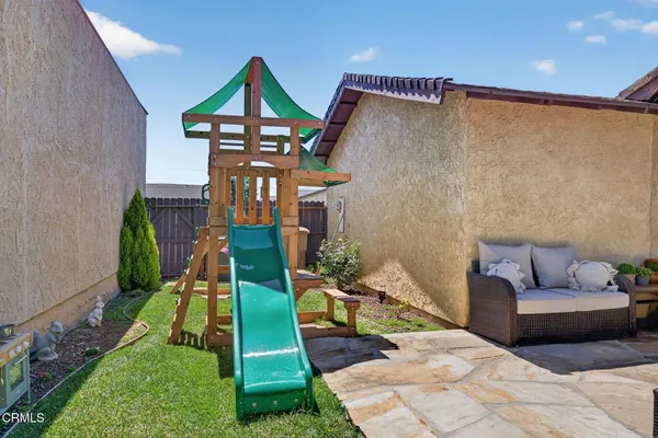 a view of a backyard of the house