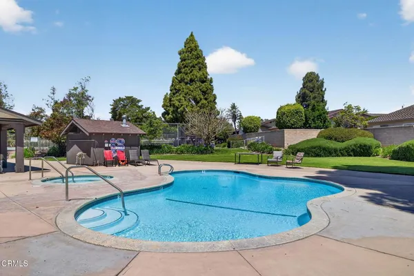 a view of swimming pool with sitting area and seating area