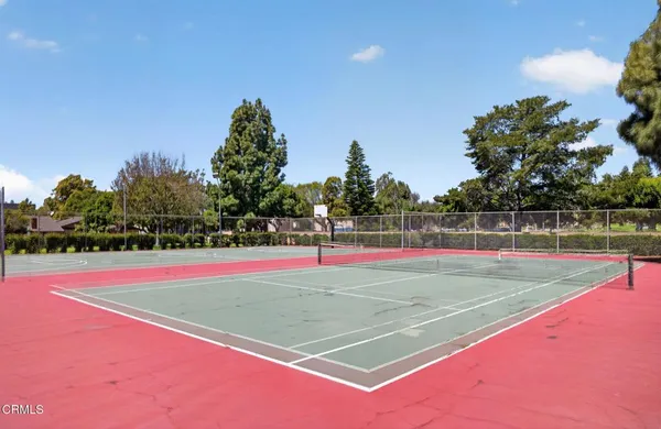 a view of an outdoor space and tennis court