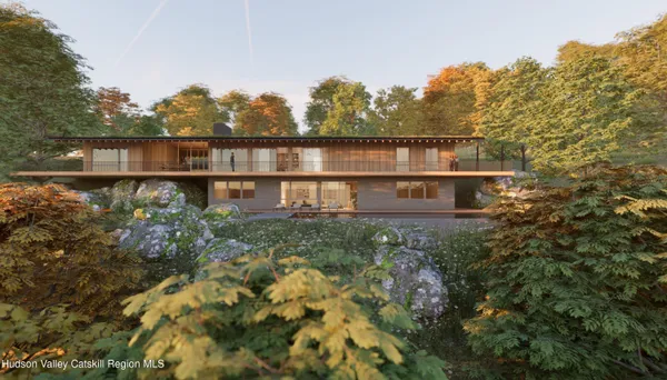 a view of a house with a yard and sitting area