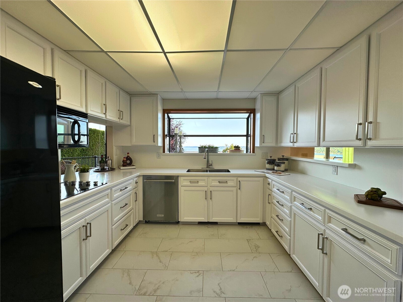714 Southwest 296th Street Federal Way, WA 98023 - Photo 13 of 40 a kitchen with a sink and cabinets