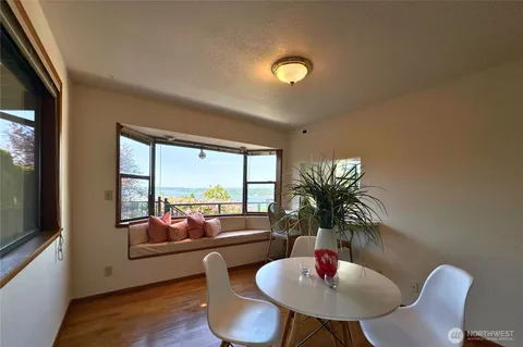 a living room with couch and a large window
