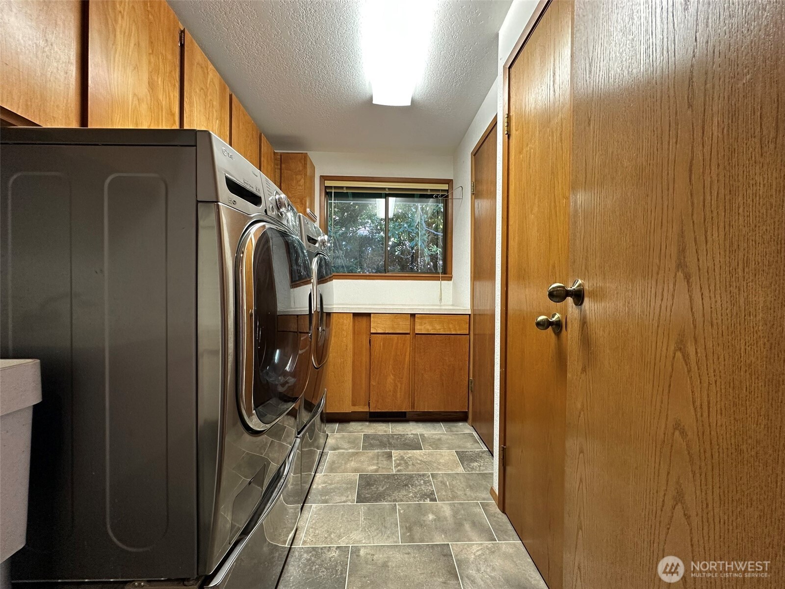 714 Southwest 296th Street Federal Way, WA 98023 - Photo 22 of 40 a bathroom with a sink a toilet and shower