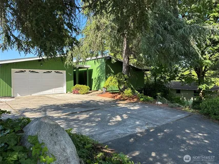 a view of a backyard of the house