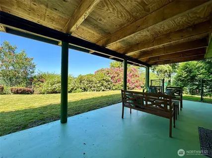 a view of house with a swimming pool
