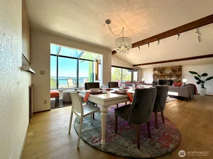 a view of a dining room with furniture window and outside view