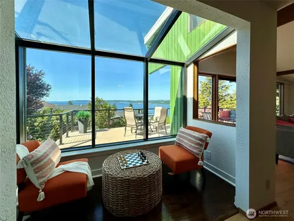 a living room filled with furniture and a window