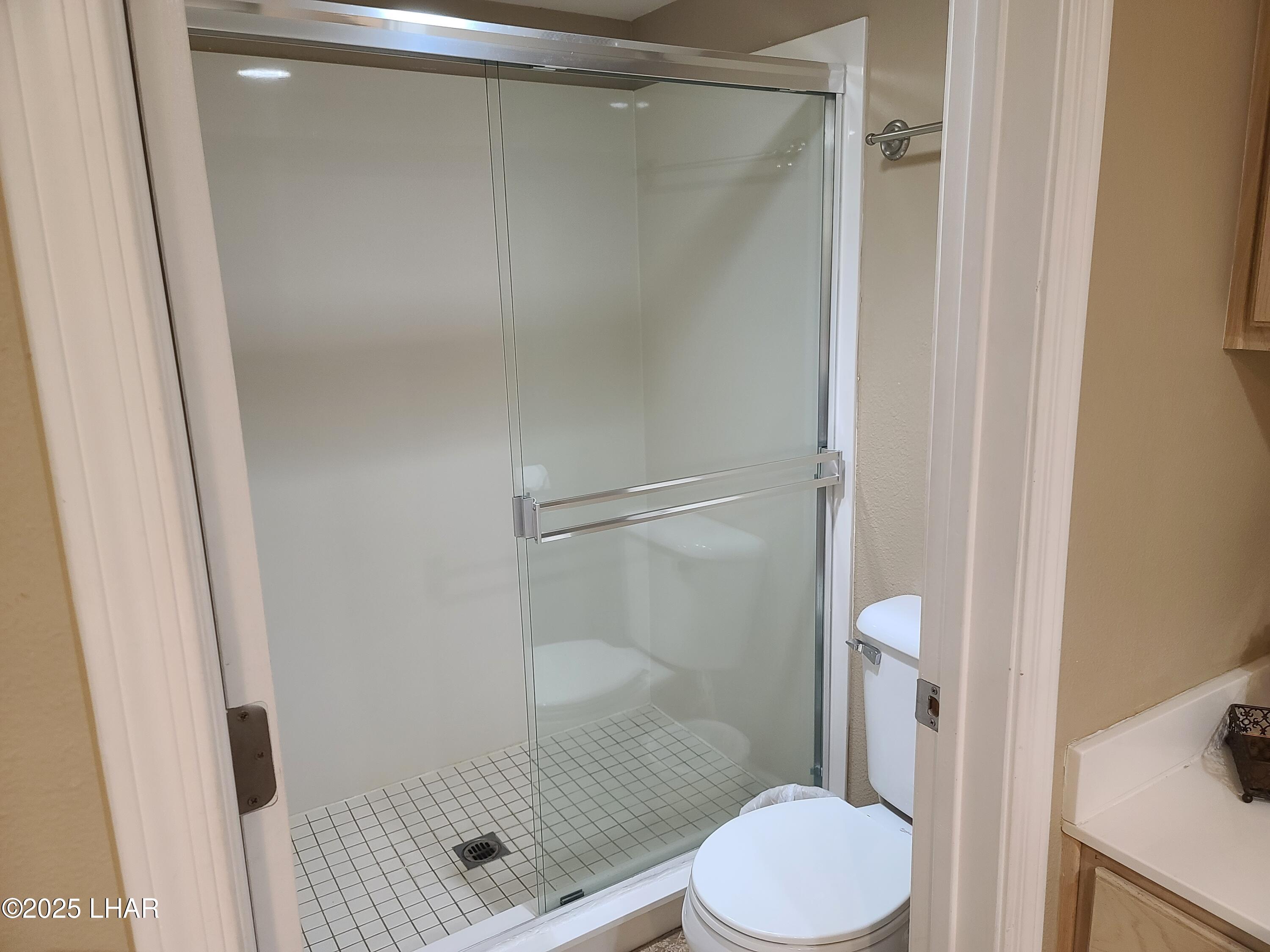 94 London Bridge Road, Unit 108 Lake Havasu City, AZ 86403 - Photo 18 of 38 a bathroom with a shower toilet and sink
