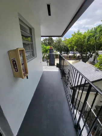 a view of balcony and furniture