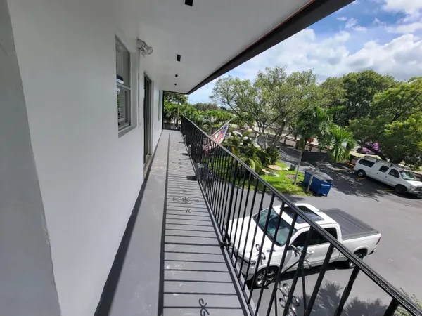 a view of a balcony with chairs