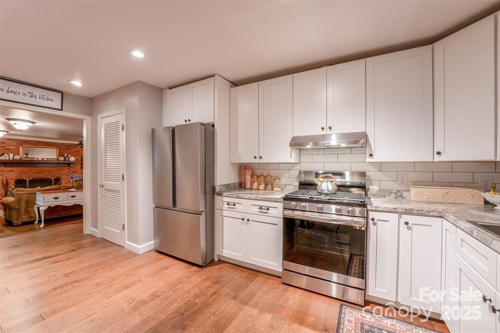 4805 Nesbit Road Monroe, NC 28112 - Photo 12 of 40 a kitchen with a stove top oven and refrigerator