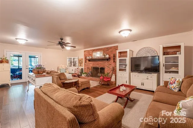 a living room with fireplace furniture and a flat screen tv