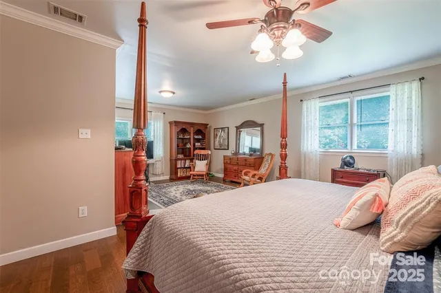 a bed room with a bed and a chandelier