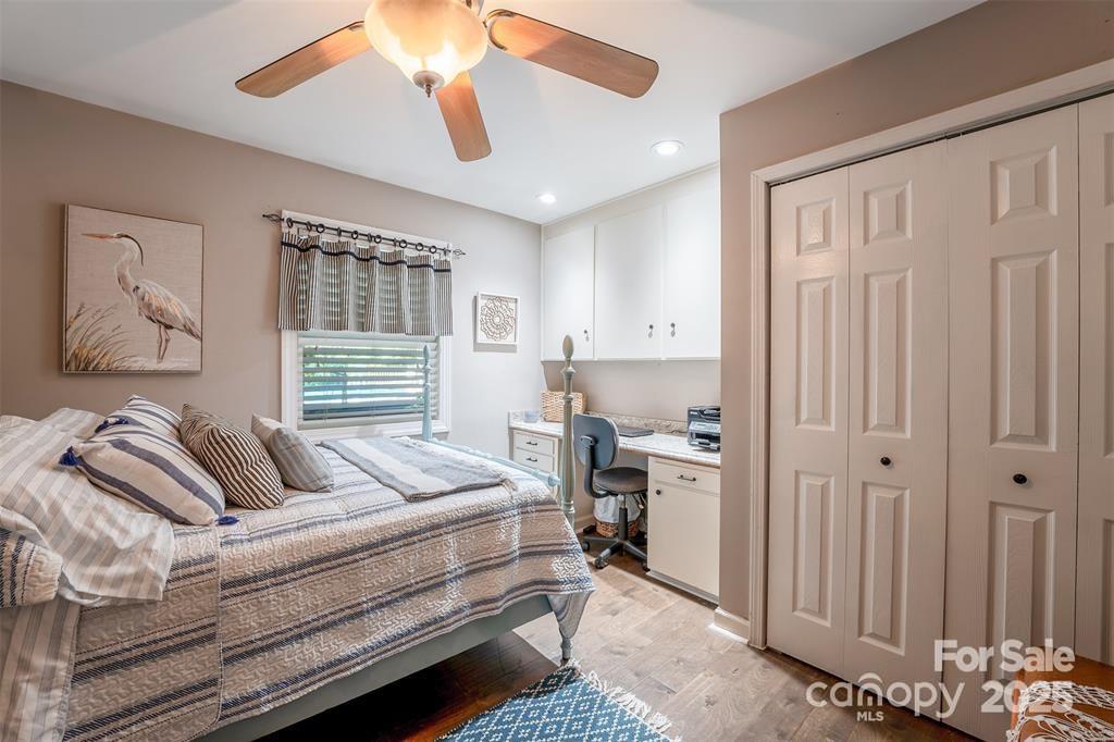 4805 Nesbit Road Monroe, NC 28112 - Photo 23 of 40 a bedroom with a bed and a chandelier