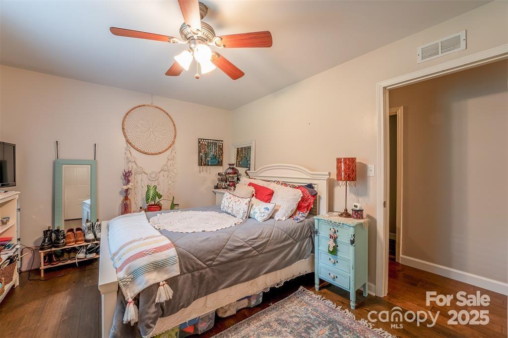 4805 Nesbit Road Monroe, NC 28112 - Photo 24 of 40 a bedroom with a bed and a chandelier