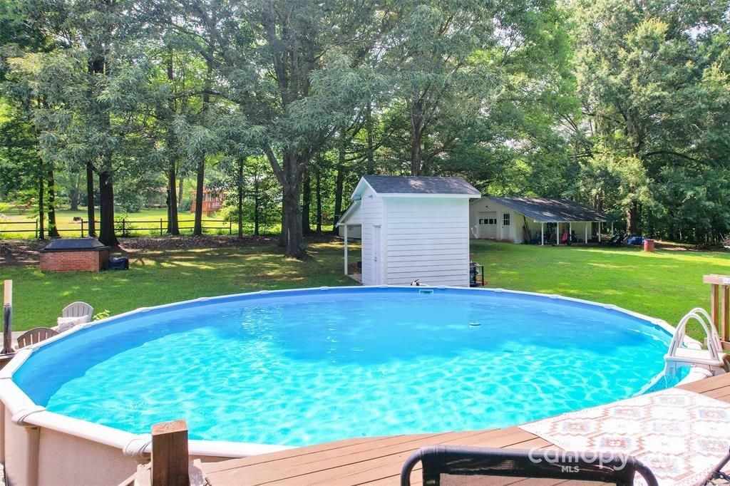 4805 Nesbit Road Monroe, NC 28112 - Photo 35 of 40 a view of a backyard with a garden and plants