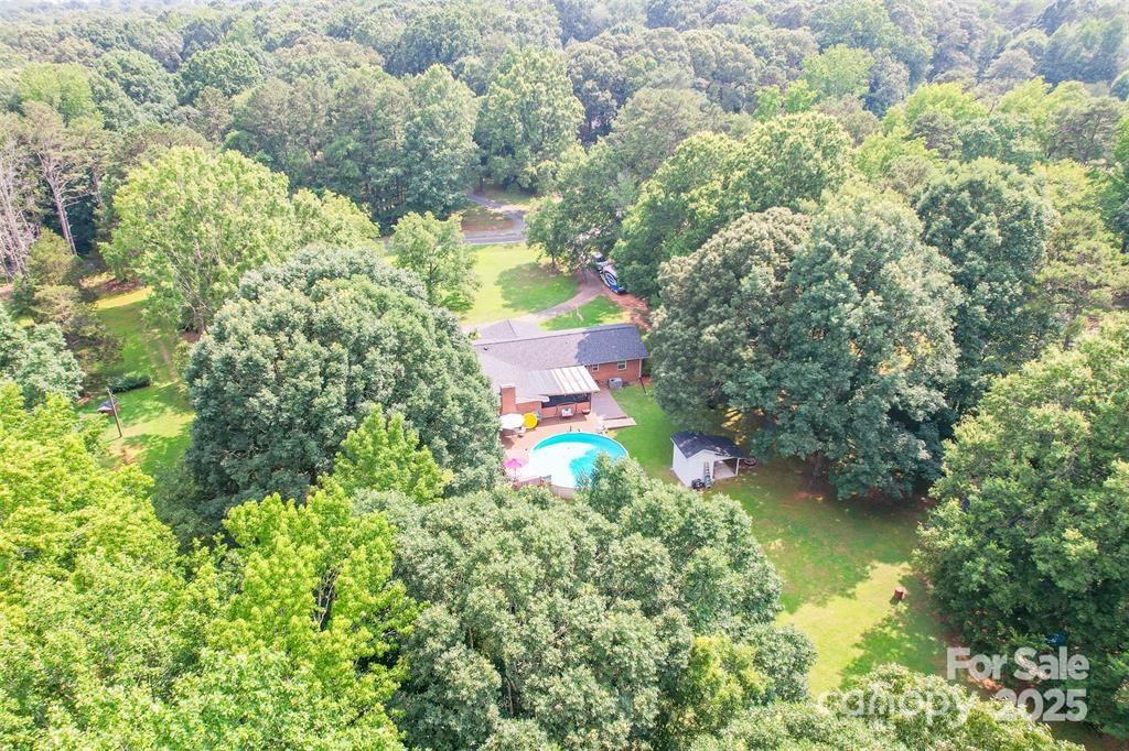4805 Nesbit Road Monroe, NC 28112 - Photo 39 of 40 an aerial view of a house with a yard and swimming pool
