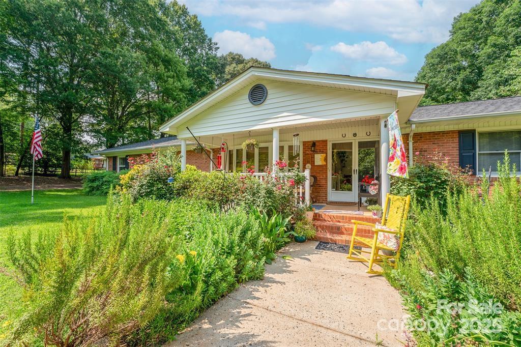 4805 Nesbit Road Monroe, NC 28112 - Photo 4 of 40 a front view of a house with a yard