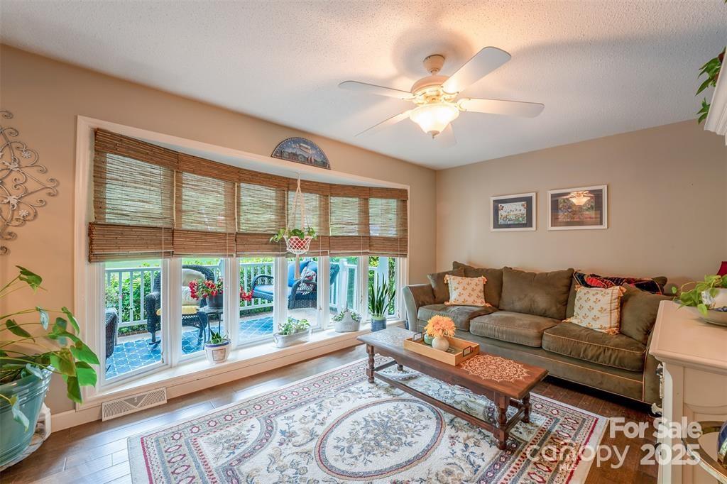 4805 Nesbit Road Monroe, NC 28112 - Photo 8 of 40 a living room with furniture and a large window with wooden floor