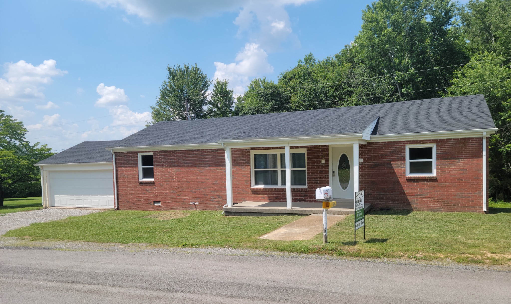 4666 Talley Road Springfield, TN 37172 - Photo 3 of 12 a front view of a house with a garden and plants