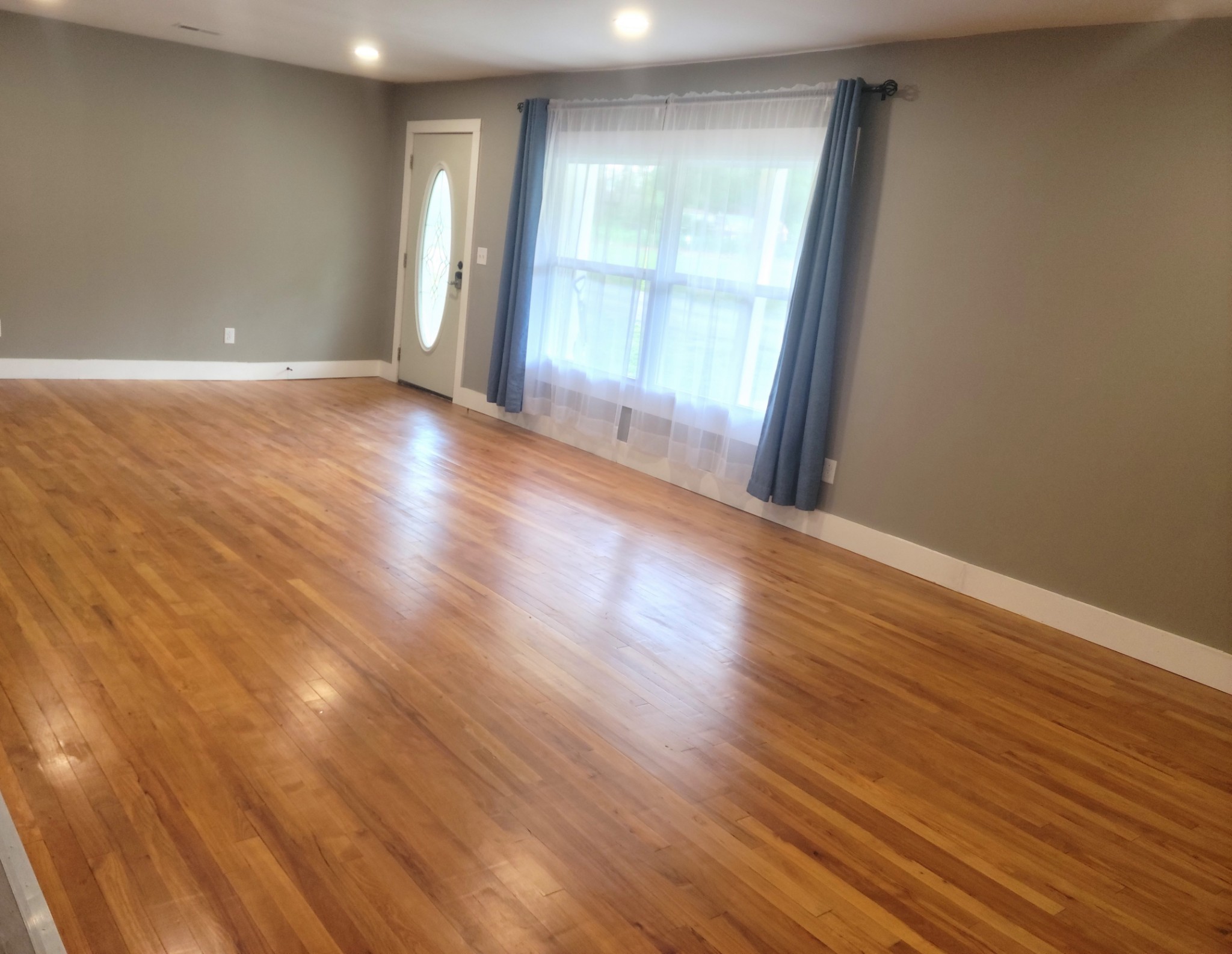 4666 Talley Road Springfield, TN 37172 - Photo 6 of 12 a view of an empty room with wooden floor and a window