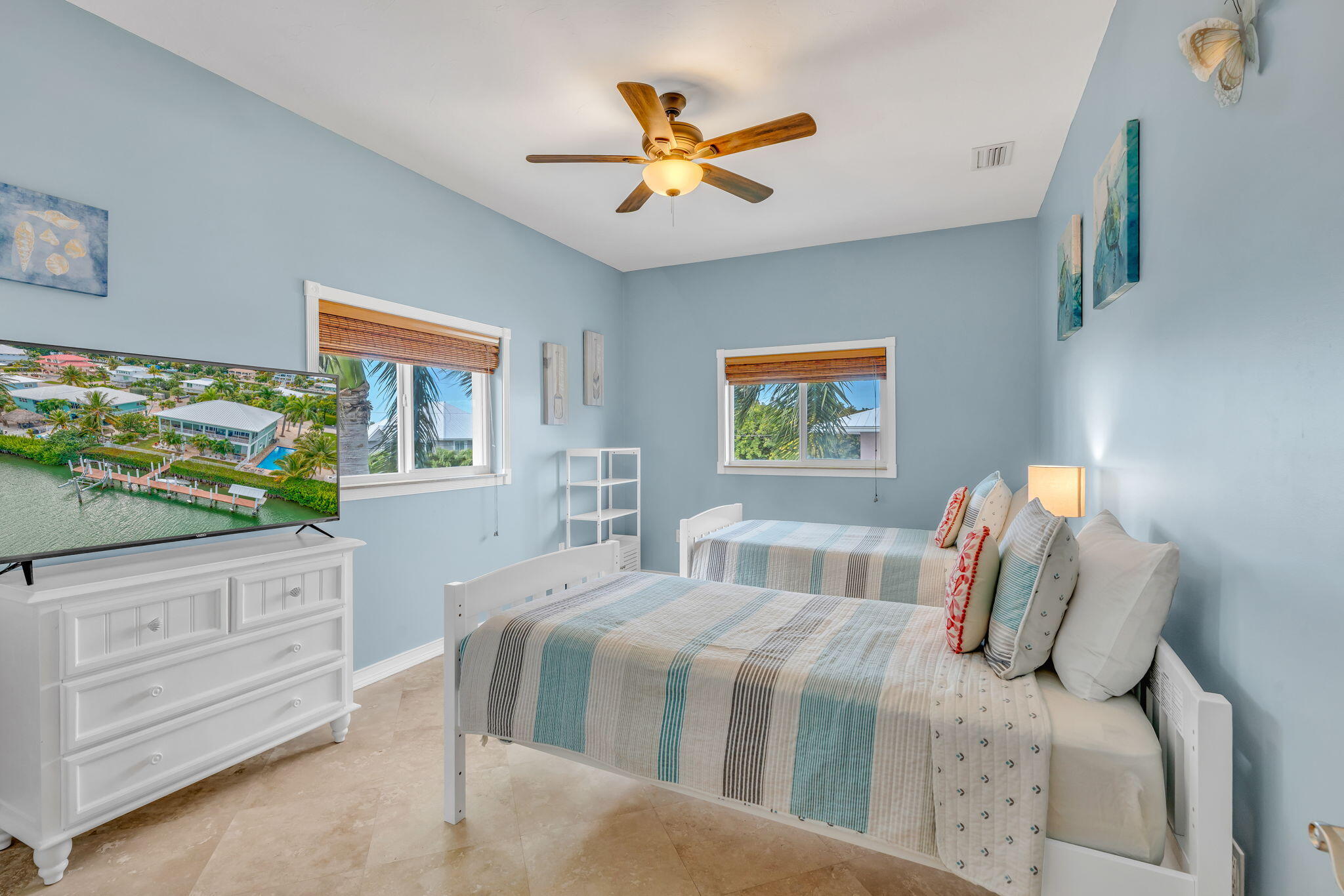 151 Ave G Marathon, FL 33050 - Photo 14 of 56 a bedroom with a bed and a dresser